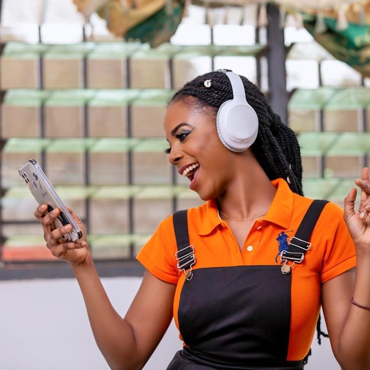 Kaveri Mehta, Lead Design Curator at RoamVerdantQuill, reviewing corporate floral arrangements